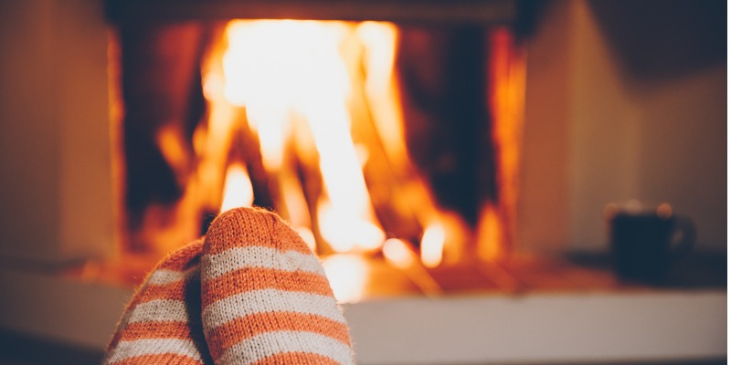fuzzy socks in front of the fire